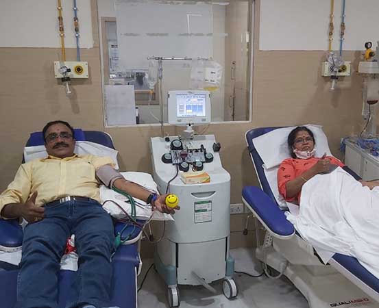 Bhoopendran V and his wife donating blood in Bengaluru