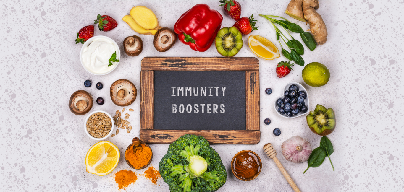 Foods that help improve immunity scattered around a black board