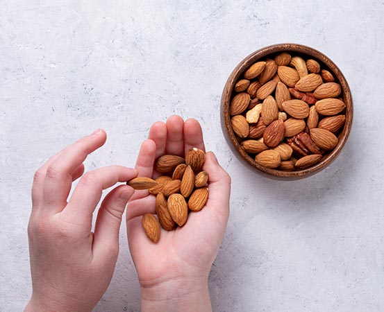 Almonds help in slowing down the absorption of nutrients from food. Having some almonds before meals will prevent sudden blood sugar spikes 